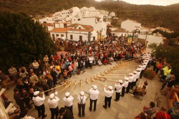 Swiss alphorn players perform in a village in Gran Canary