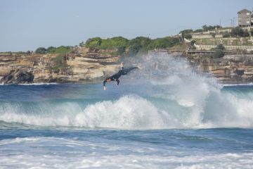 Sydney, Australia - May 21, 2017. Surfer wiping out at Tamarama Beach Sydney, Australia - May 21, 2017. Surfer wiping out at Tamarama Beach
