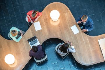 A team of people working together at a university A team of people working together at a university