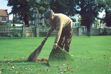man sweeping under