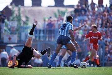 Football player falling over