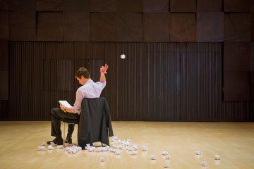 Man scrapping pieces of paper