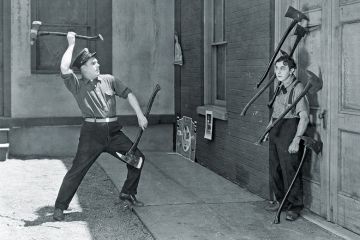 Man throwing axes