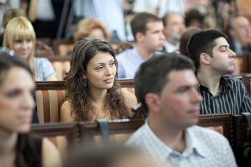 A student sitting in a lecture theatre