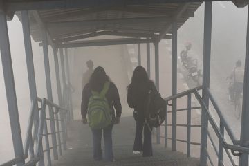 Image of students walking down stairs in the fog