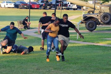 People running a three-legged race