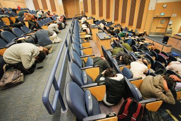 Image of students doing an earthquake drill to illustrate the huge impact of the fall in international enrolment