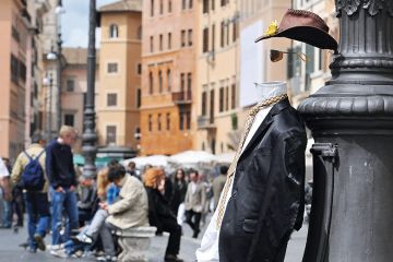 Invisible man in a town square