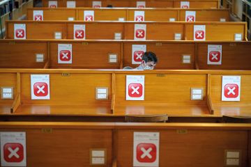 Academics study in the socially distanced reading rooms at the Bodleian Libraries in Oxford, England