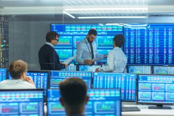 Three Experienced Stock Traders Talking Business