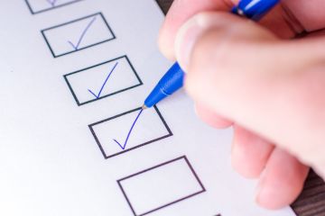 A person ticking boxes