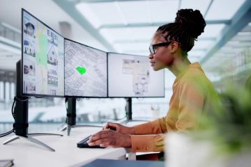 A town planner looks at her computer screen