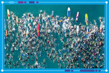 Aerial view of an iron man swimming event, to illustrate the shifts in positions of universities in the World University Rankings