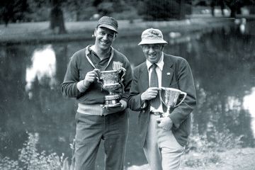Two men with trophies