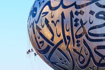 UAE, Dubai - November 29, 2021 People wash windows at Museum of Future