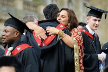 University graduates hugging and celebrating University graduates hugging and celebrating
