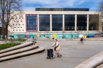 People on Kings Square, part of a regeneration project with the old Debenhams building becoming the University of Gloucestershire's City Campus, Gloucester, United Kingdom People on Kings Square, part of a regeneration project with the old Debenhams building becoming the University of Gloucestershire's City Campus, Gloucester, United Kingdom