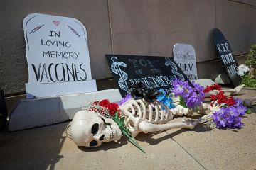 A memorial for the loss of funding for research and public health programs is placed in front of the National Institutes of Health (NIH), 10 May, 2025 in Bethesda, Maryland. A protest against Robert F. Kennedy, Jr.'s "Make America Healthy Again" movement.