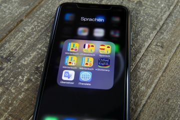 Viersen, Germany - June 30. 2020 Close up of isolated mobile phone screen with collection of translation and dictionary apps for travel