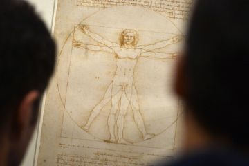 People look at the "Vitruvian Man" a drawing by Leonardo da Vinci, illustrating the combination of arts and science
