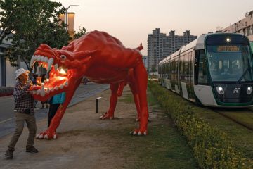 Dragon art installation outside the area of the Pier-2 Art Center in Kaohsiung, Taiwan with trams passing through Dragon art installation outside the area of the Pier-2 Art Center in Kaohsiung, Taiwan with trams passing through to illustrate China ‘intimidating’ international academics travelling to Taiwan
