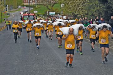 Competitors take part in the Men’s Veterans’ Race at the annual World Coal Carrying Championships Competitors take part in the Men’s Veterans’ Race at the annual World Coal Carrying Championships to illustrate PhDs for everyone will not improve academia