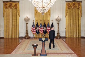  President Joe Biden walks away from the podium 