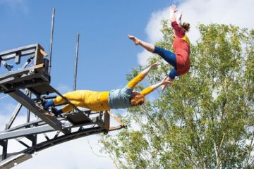 Performers launch themselves off the Imagineer Bridge in Warwick Performers launch themselves off the Imagineer Bridge in Warwick to illustrate ‘Contagion’ risk if UK university goes under, warns report