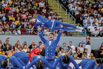 Cheering squad from the Ateneo De Manila University perform to illustrate Fee-free Philippines degrees ‘threaten the viability of the private sector’