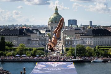  Person dives from the 28 metre platform at the Copenhagen Opera House. to illustrate regions hit hardest as Danish applications drop 11 per cent