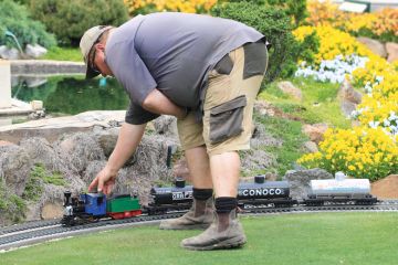 A staff member checks a mini train at Cockington Green Gardens in Canberra, Australia to illustrate Vice-chancellor questions Australia’s embrace of microcredentials