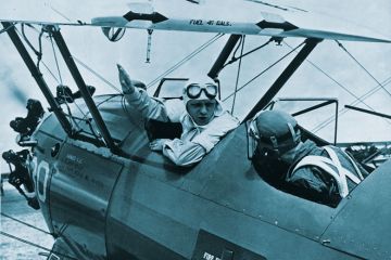 Army Air Corp instructor gives some pre-takeoff advice to his student  to illustrate As undergraduate numbers soar and student needs become increasingly complex