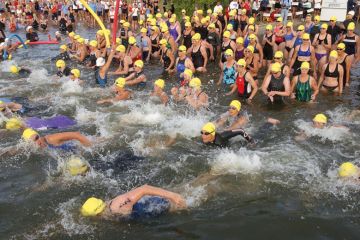 Over 2,300 people swim out to the sea as they take part in the Danskin Women's Triathlon Series to illustrate Mass resignations from diamond journal over £2,500 author fees