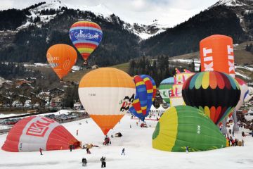 Hot air balloons take off in the Swiss Alps to illustrate Squeezed Swiss weigh EU alliances against global mobility