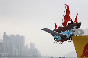 A participant sits in his structure that features a traditional Chinese fishing boat at the Red Bull Flugtag (flight day) competition in Hong Kong A participant sits in his structure that features a traditional Chinese fishing boat at the Red Bull Flugtag (flight day) competition on a cloudy day in Hong Kong to illustrate Opaque investigation fails to clear clouds over HKU council
