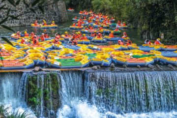 Tourists ride in inflatable boats as they go rafting in Cun an County, Hangzhou City, Zhejiang Province of China Tourists ride in inflatable boats as they go rafting in Cun an County, Hangzhou City, Zhejiang Province of China to illustrate African students on wrong side of China’s ‘two-track’ system