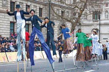 Circus taking part in London's New Year's Day Parade, Whitehall, London England Circus taking part in London's New Year's Day Parade, Whitehall, London England, to illustrate Who should pay to fill fee deficit, students or the public?