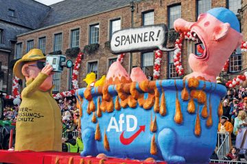 Carnival float depicting the secret service spying on right-wing party AfD in Dusseldorf. Carnival float depicting the secret service spying on right-wing party AfD in Dusseldorf. to illustrate German universities could be ‘less attractive’ as far right rises