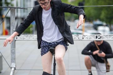Street performer removes his trousers while riding a unicycle in Christchurch, New Zealand Street performer removes his trousers while riding a unicycle Christchurch, New Zealand to illustrate New Zealand universities ‘losing money’ on crucial subjects