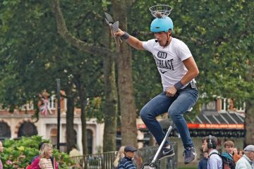 A juggling unicyclist dismounts from his cycle in Leicester Square in London to illustrate Role of HE in skills ‘crucial’