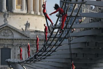 Dancers bungee off the Millennium Bridge, London, UK Dancers bungee off the Millennium Bridge, London, UK to illustrate nearly nine in 10 are facing job cuts