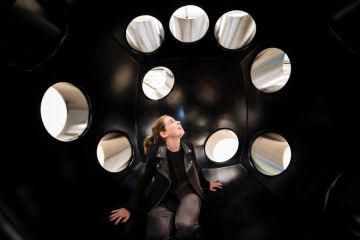 Woman sitting in an art installation looking at the holes to illustrate don’t fear losing Elsevier access, California negotiator tells UK