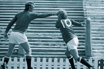 Two footballers play fight to illustrate Interdisciplinarity lacks clout to keep its cash