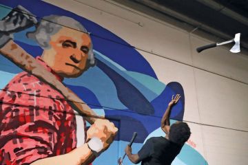 Axe Master Omar Cooper throws a hatchet backwards at a target in Washington, DC to illustrate National Science Foundation set for budget cut