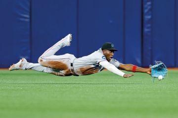 Jesus Sanchez #7 of the Miami Marlins misses a fly ball during a game  to illustrate Sasse puts focus on under-performing academics at Florida