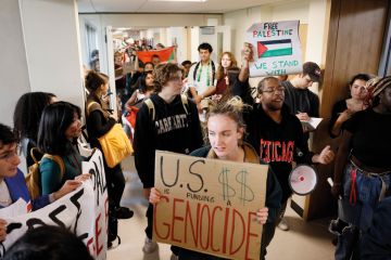 Students at University of Massachusetts Amherst stage a sit in and present their demands to the Chancellor to end what they called, "UMass Amherst's ties with war profiteers and call for a ceasefire
