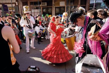 Woman in flamenco dress dancing in New Orleans to illustrate European business schools ‘should not get into US-style culture wars’
