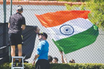 The Indian flag flies as ground staff erect netting in front as a metaphor that  Some Antipodean universities face an existential threat from the loss of Indian students.