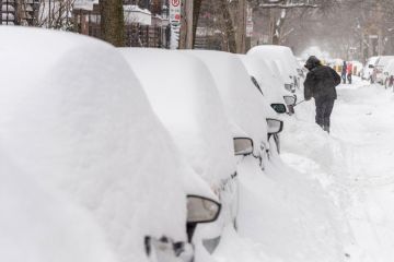 Line of cars stuck in the snow