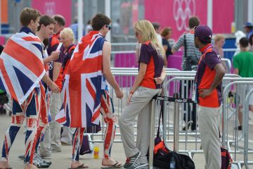 People wearing UK flag outfits walk through gates to illustrate Student number controls for England ‘still under discussion’
